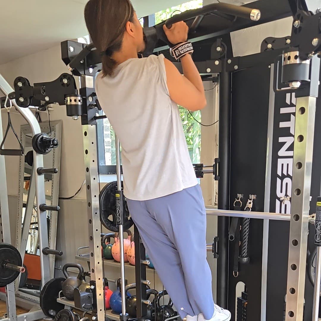 First strict chin-up. The high-five above is the moment after she dropped down.